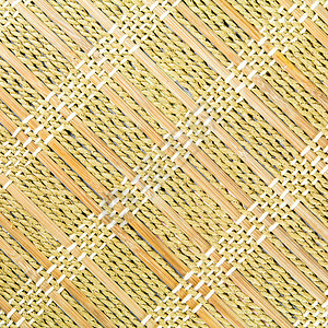 竹垫乡村餐垫宏观棕色编织检查格子黄色纤维稻草背景图片
