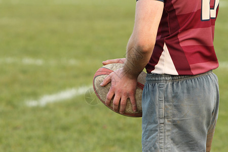 持有橄榄球的橄榄球运动员竞赛男人线路手腕输出运动游戏力量玩家能量背景图片