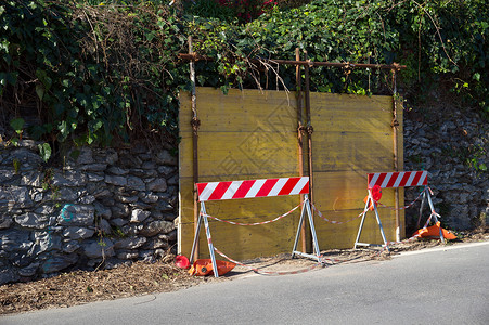 墙壁城市黄色障碍木板街道路标危险磁带石头工作背景图片