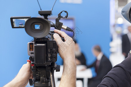 录像摄像机报告文学活动媒体摄像师职业信息记者广播电视台人手背景图片