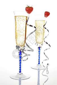 香槟和草莓水晶饮料黄色玻璃丝带奢华派对生日气泡纪念日背景图片