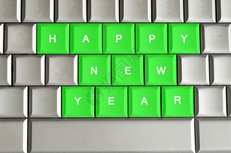 新年快乐 写在金属键盘上背景图片