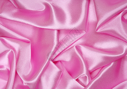平滑优雅的粉色丝绸作为背景纺织品投标海浪材料紫丁香曲线布料织物薰衣草婚礼背景图片