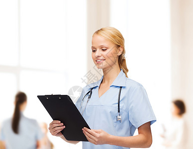 解剖学家带剪贴板 微笑着的女医生或护士成人情况诊所学生医院儿科会议团体职员援助背景