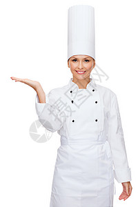 手握着东西的女厨师笑着微笑酒店广告食物工作女士美食助手棕榈餐厅职业背景图片