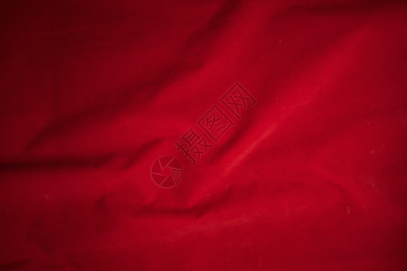 暗红色背景用于背景的暗红色天鹅绒织物背景