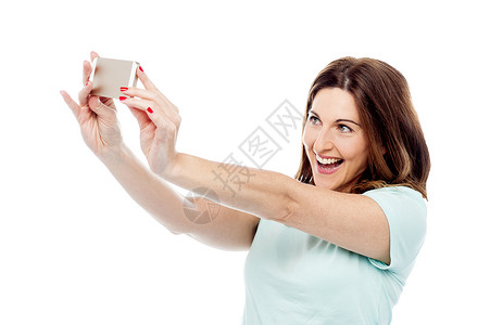 有魅力的女人 正在用手机拍照呢?背景图片
