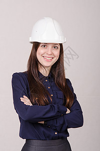 戴头盔的女工程师肖像背景图片