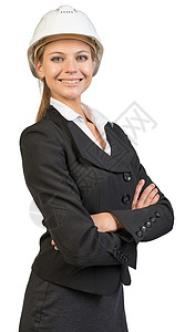 身戴硬帽子的女商务人士 她的双臂交叉胸怀工作安全帽照片员工预防工作室头盔女性职业安全背景图片