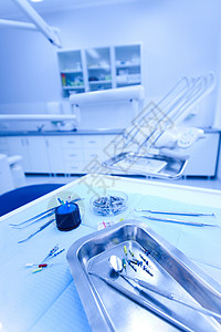 牙医用具牙科办公室 有明亮多彩的音调概念椅子座位手术牙齿药品医生外科口服矫正牙医背景