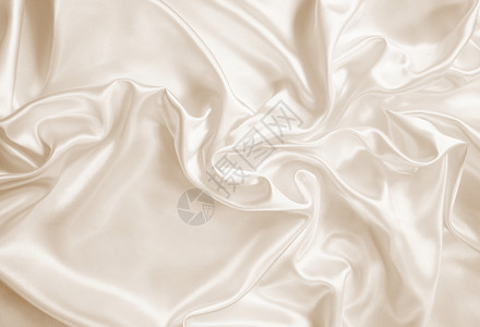 银色布平滑优雅的金丝绸或作为背景的沙丁鱼海浪新娘调子丝绸婚礼织物折痕材料版税涟漪背景