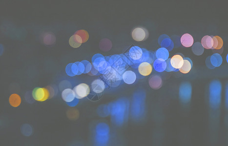 市内夜幕背景带boke艺术圆圈蓝色黄色背景图片