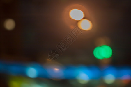 市内夜幕背景带boke艺术黄色圆圈橙子背景图片