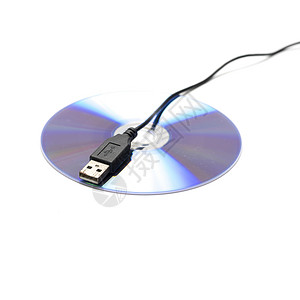 dvd使用在 dvd 盘子上的 usb 电缆磁盘职业网络互联网数据技术白色办公室电脑键盘背景