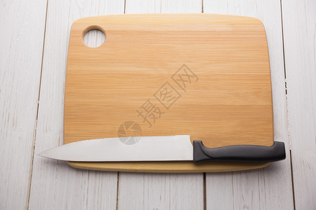 拿着大刀的购物板厨艺阴影木板用具美食切菜板烹饪背景图片