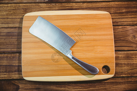 拿着大刀的购物板屠夫厨艺用具美食阴影烹饪切菜板木板背景图片