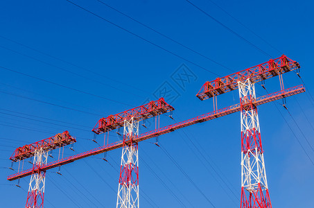 高压电线电压变压器天空活力两极公用事业电气金属蓝天桁架背景图片