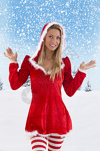 服饰换新季首页女性圣诞老人的肖像 在雪地背景上摆姿势面部季节裙子场地情感服装成人符号感觉表情背景