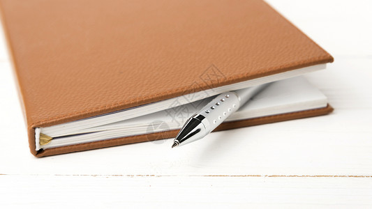 笔和笔教育记事本商业办公室文档笔记本日记螺旋笔记软垫背景图片
