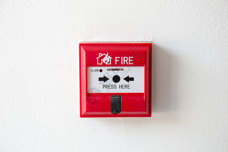 火灾报警系统在水泥墙的水泥墙上为警报和安全系统按下按钮开关火报警箱背景