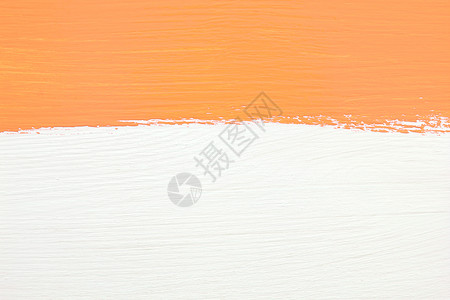 橙色涂料在白木本面上背景图片