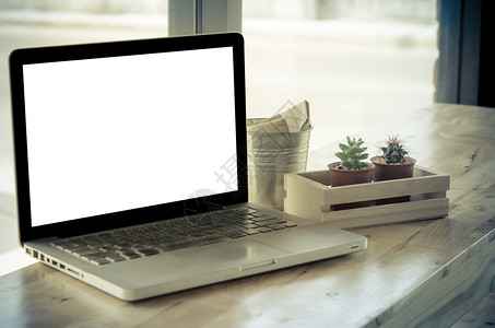 电脑放在桌上桌子技术商业办公室白色屏幕职场工作笔记本展示背景图片