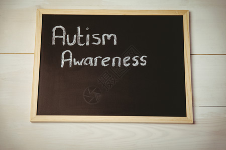 黑板上的自闭症意识综合症粉笔宣传疾病背景图片