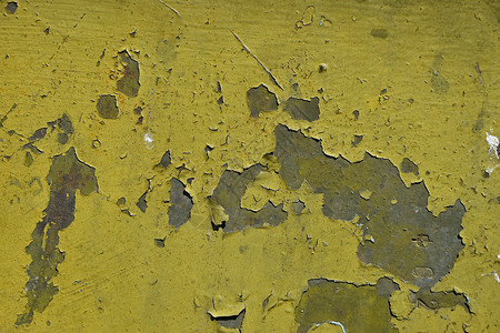 涂有灰色锈漆的金属表面和薄片染色黄色棕色衰变卡其色划痕腐蚀氧化绿色背景图片