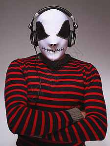 戴面罩的Dj打碟机音乐面具男性耳机男人条纹套装成人高清图片