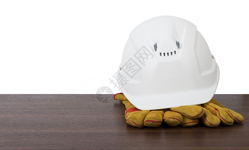塑料安全头盔安全帽预防工作服工程师手套背景图片