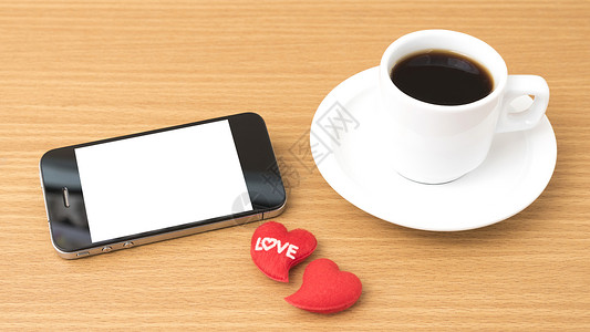 咖啡杯 电话和心脏白色手机咖啡桌子办公室杯子红色背景图片
