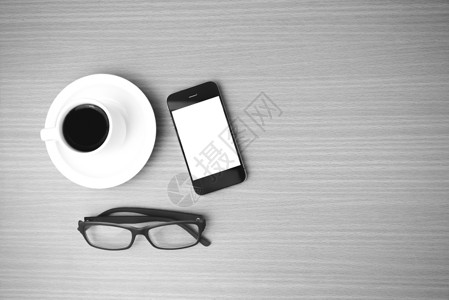咖啡杯 电话和眼镜咖啡商业手机创造力办公室杯子桌子植物工作背景图片