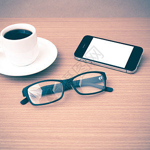 咖啡杯 电话和眼镜植物手机工作咖啡商业创造力桌子办公室杯子背景图片