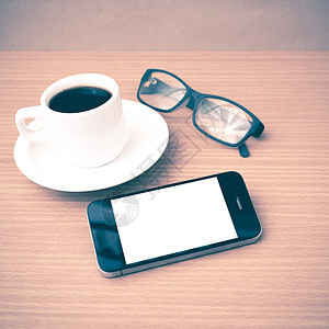 咖啡杯 电话和眼镜植物桌子杯子手机工作办公室咖啡商业创造力背景图片