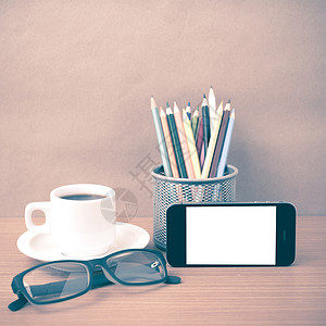 咖啡 电话 眼镜和铅笔日记桌子杯子技术办公室记事本手机职场商业背景图片