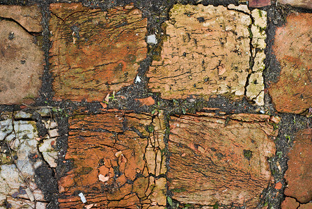裂缝中旧脏砖的纹理石方历史黏土棕色红色灰色材料砖墙标准矩形背景图片
