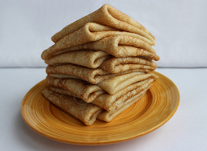 狂欢周动图盘子上的黄油煎饼是古代斯拉夫嘉年华庆典的象征狂欢节日活动生产率饶恕用法食物欢乐黄油异教徒背景