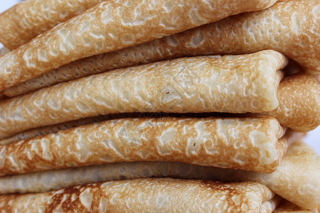 嘉年华煎饼盘子上的黄油煎饼是古代斯拉夫嘉年华庆典的象征仪式传统欢乐用法蛋糕民间生产率票价煎饼食物背景