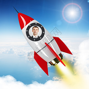 飞翔的火箭青年商务人士用火箭在空中飞翔背景