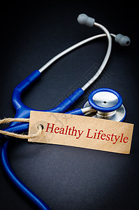 健康生活方式用听诊器写在纸标签上背景图片