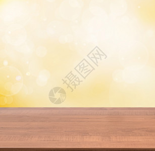 抽象金背景的木形空桌桌子小样产品台面派对火花辉光柜台推介会商业背景图片