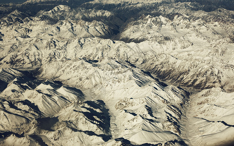 雪梦山区山脉 美丽的雪山 从空中看一看旅游墙纸冰川空气框架保护天线岩石蓝色屏幕背景