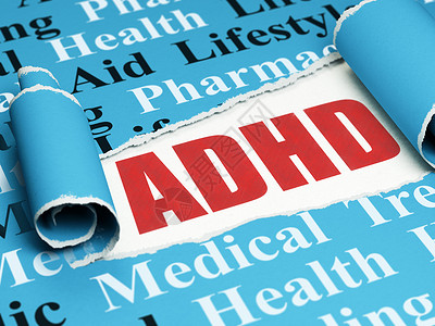 健康概念 红色文字 ADHD 在撕破纸下面高清图片