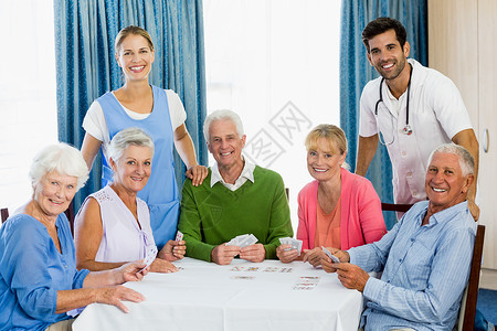 娱乐性老年人打牌老年病娱乐医学老年医疗保险微笑保健女士朋友男性背景