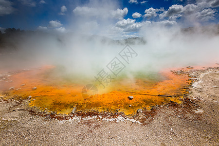 热蒸汽新西兰罗托鲁阿州保留地香槟池地质学陨石火山蓝色沸腾橙子水池气泡蒸汽旅行背景