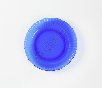 蓝玻璃沙拉盘沙拉盘玻璃盘轮缘盘子玻璃扇形餐具圆形蓝色漩涡背景图片