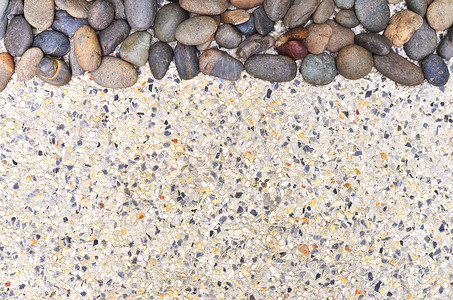 砾石背景上的小石头白色黑色卵石灰色地面碎石岩石背景图片