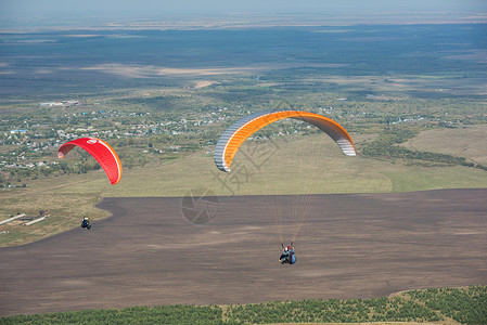 山岳的滑坡运动员降落伞飞行竞赛段落跳伞团队活动肾上腺素旅行背景图片