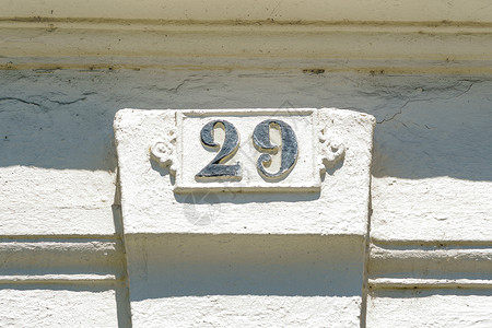 二十九29号门牌地址素数金属字母序数点缀白色房子正方形背景