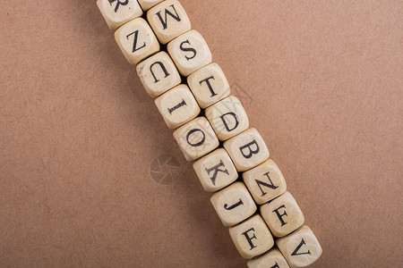 由木制成的字母立方填字公司玩具标题刻字游戏孩子字幕拼写童年背景图片